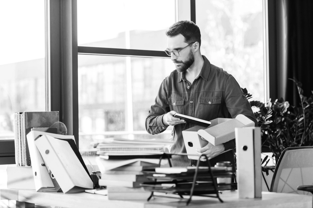 Image of a male business owners with disorganised office